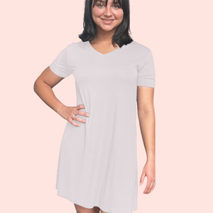 Woman in her 50's in a Bamboo Nightshirt/ Nightgown in Cream, White background variant::dusty ilac