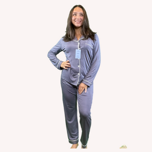 Woman with dark harir and one hand on her hip wearing dark gray  bamboo pajamas with white trim variant::Gray