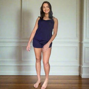 variant::navy blue front view of woman with brown hair  wearing a black bamboo cami set especially designed for menopause relief from hot flashes and night sweats 