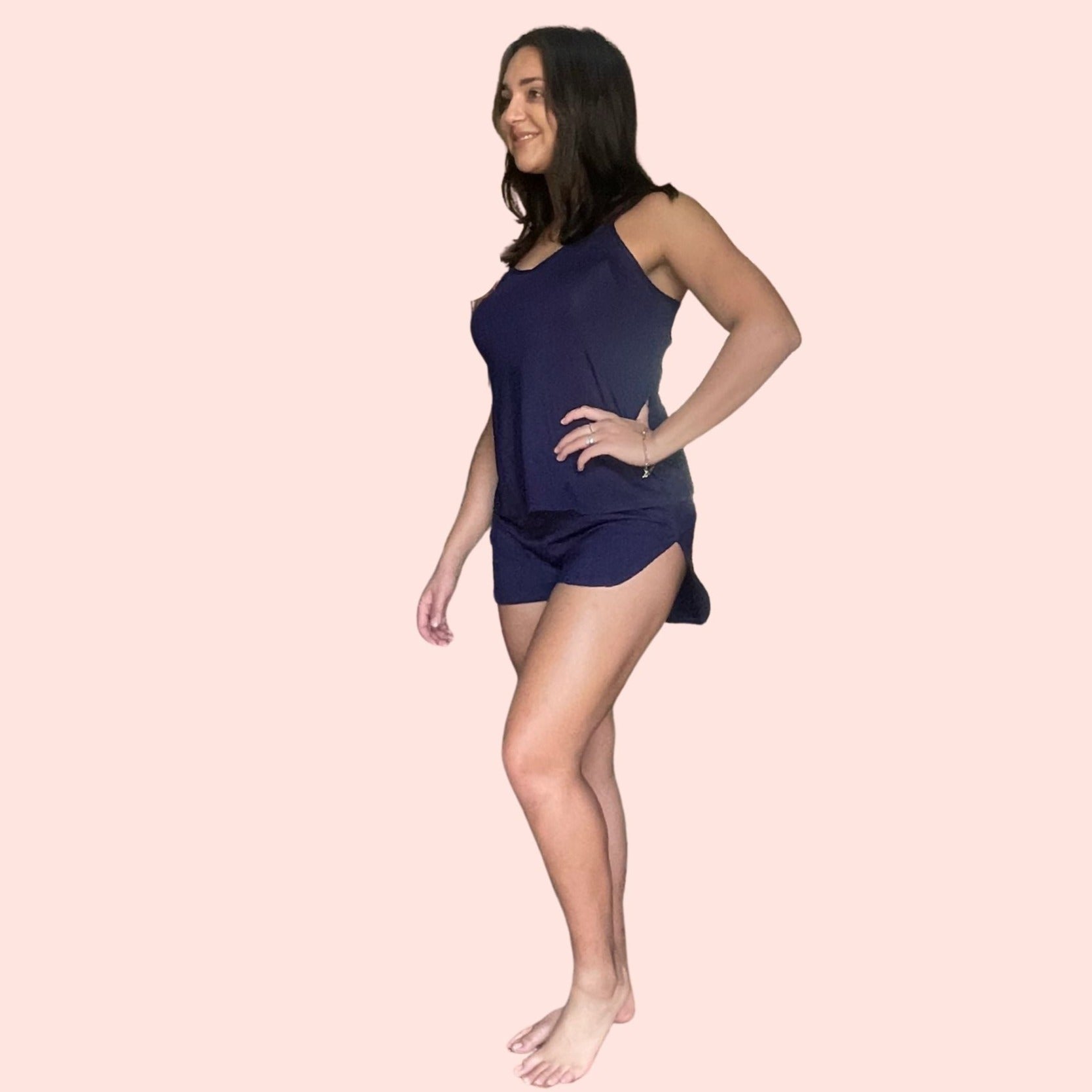 Side iew of woman with brown hair  wearing a navy bamboo cami set especially designed for menopause relief from hot flashes and night sweats variant::navy