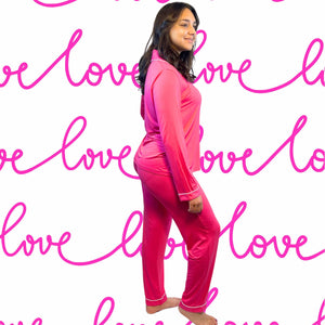 Valentine&#39;s Day Fuchsia Long Bamboo Pajamas modeled by a young woman with shoulder-length dark hair.