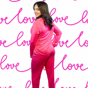 Valentine&#39;s Day Fuchsia Long Bamboo Pajamas modeled by a young woman with shoulder-length dark hair.