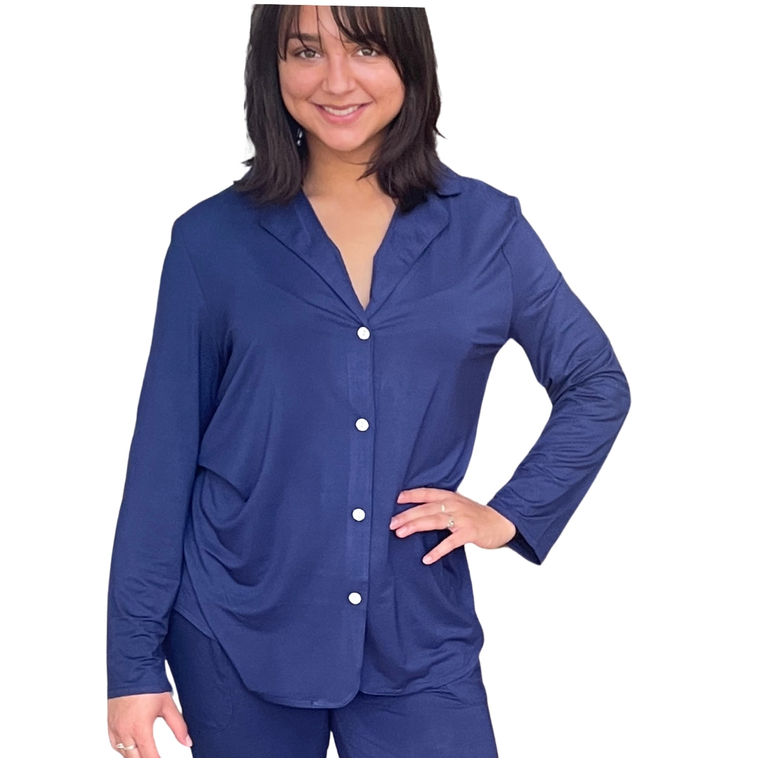 Woman with dark brown hair and her hand on her hip. She is wearing the Live-In Blue lenzing modal/ Bamboo pajama shirt with Velcro closure. Modal/bamboo is great at wicking moisture away and suitable for night sweats.