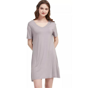 Woman in her 50's in a Bamboo Nightshirt/ Nightgown in Cream, White background variant::Dusty Lilac