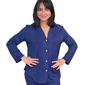 Woman with dark brown hair and both  hands on her hips. She is wearing the Live-In Blue lenzing modal/ Bamboo pajama shirt with Velcro closure. Modal/bamboo is great at wicking moisture away and suitable for night sweats.